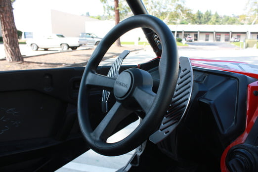 Black anodized paddle shifters with post machined chamfers giving silver contours installed on the honda talon. Side Angle.